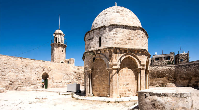 The Chapel of the Ascension on the Mount of Olives with a blue clean sky