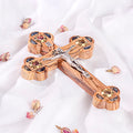 Budded Crucifix with Star of Bethlehem on white background with rose petals